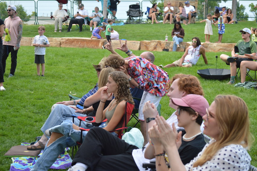 Audience members applauding performers during "The Perfect Playlist" concert, the first-ever event of the Centennial Arts and Cultural Foundation, on July 31, 2022.